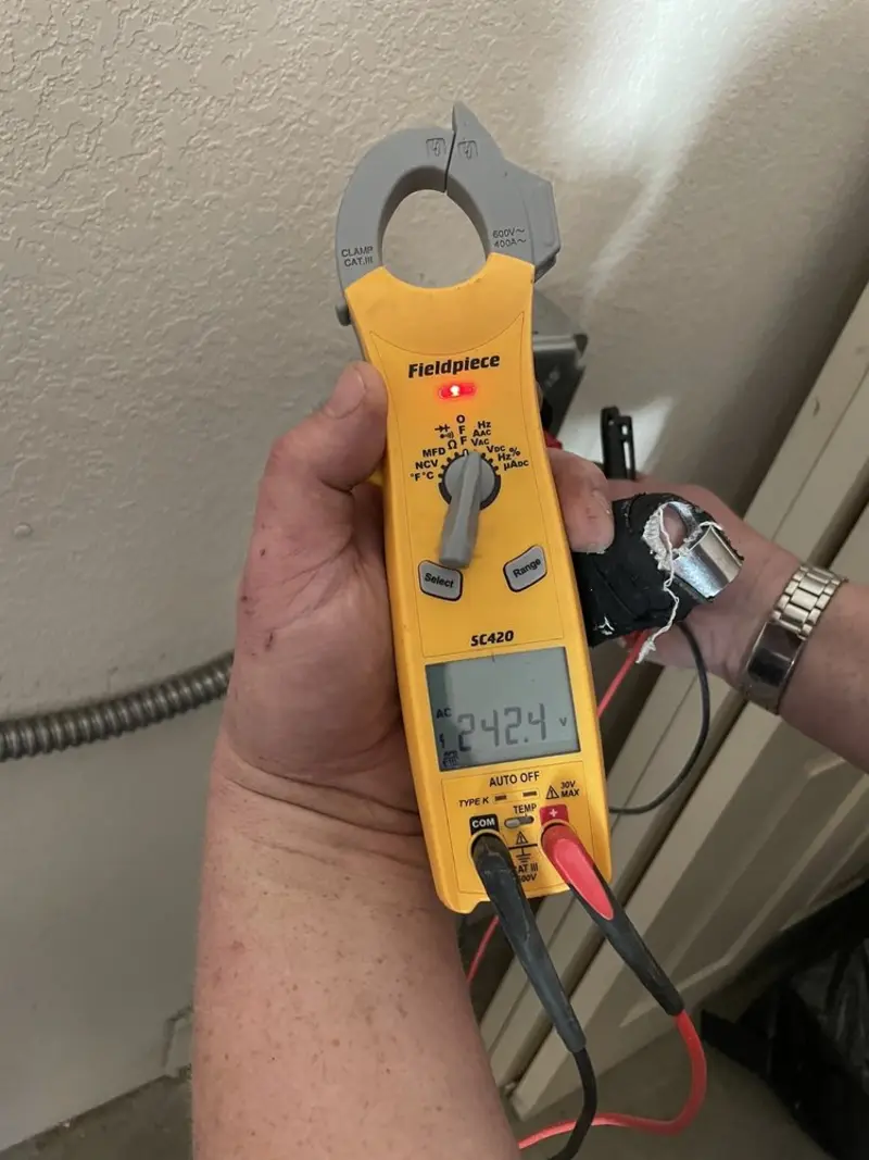 Voltage testing with clamp meter during Generator Installation in Oakley